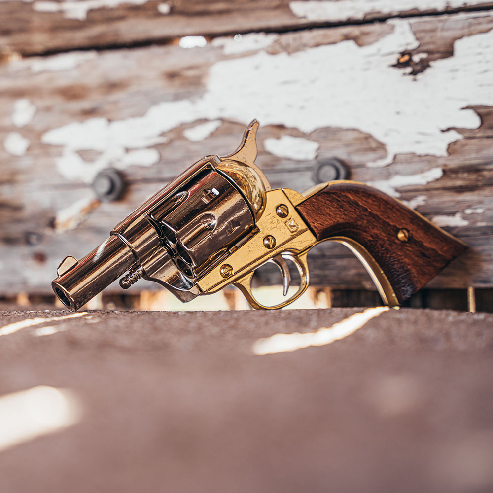 non firing 1873 45 caliber short revolver on wood