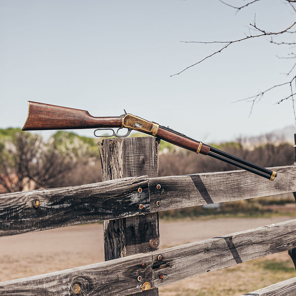 kolser old west 1892 rifle replica on a wooden rail
