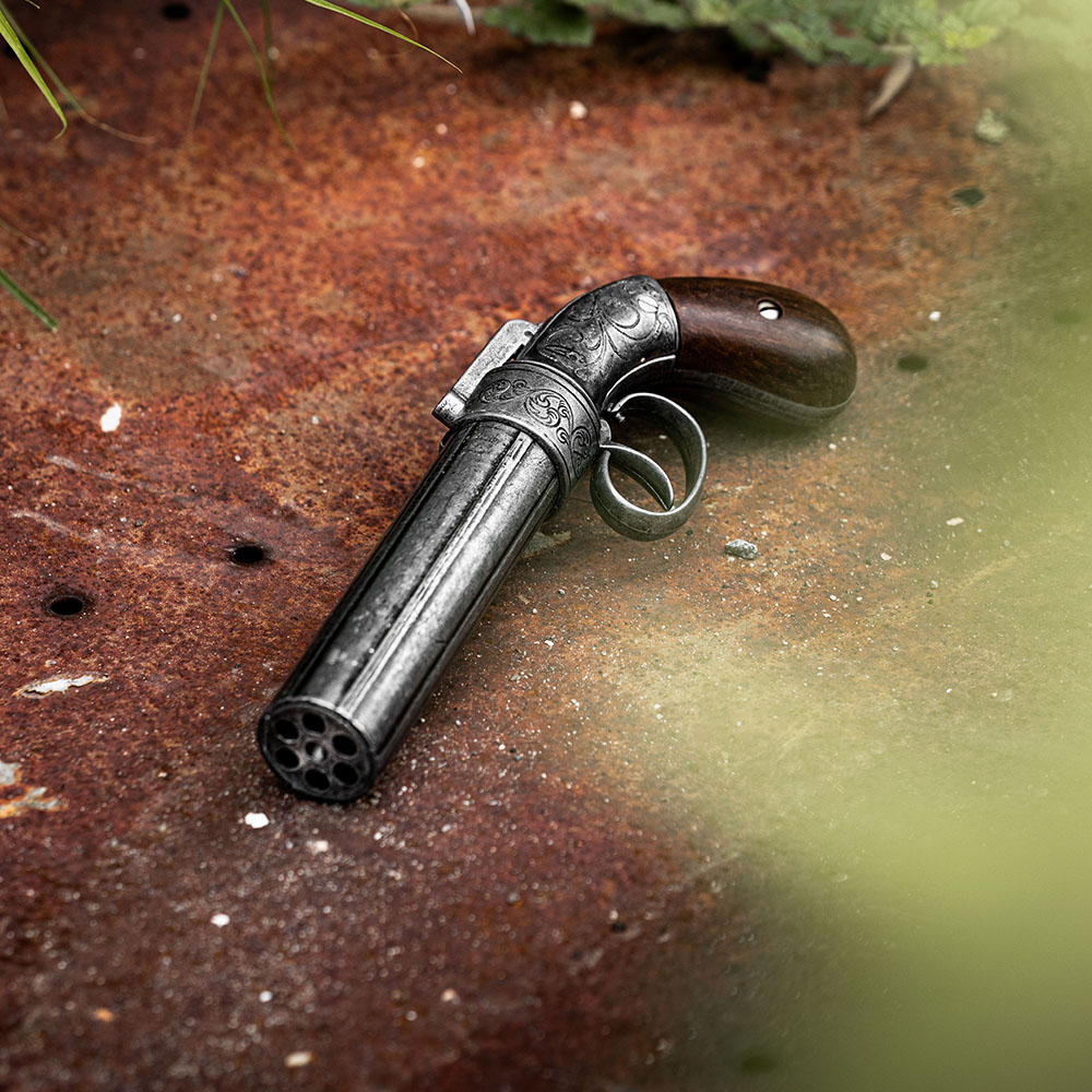 1837 pepperbox revolver replica on old metal sheet
