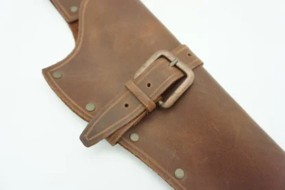brown gun holster with a buckle strap