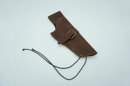 brown gun holster with a buckle strap and strings