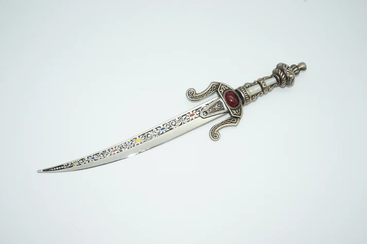 Top view of toledo dagger embelleshed blade decorative grip and pommel