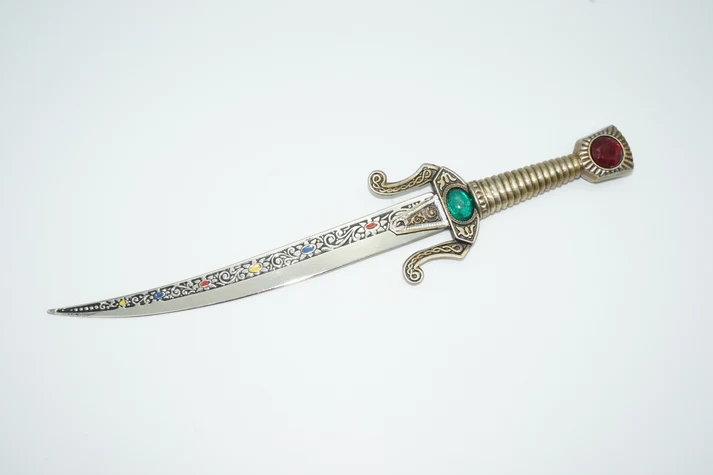 Seville dagger top view with inlaid blade and faux ruby and emerald