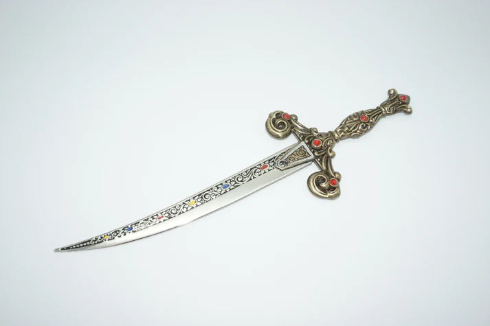 13th century spanish dagger with silver accents out of sheath