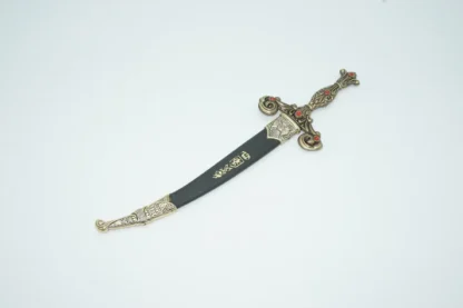 Top view of 13th Century Spanish dagger in sheath with brass accents.