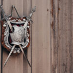 Kolser shield hanging on a wooden wall.