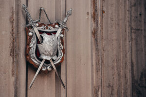 Kolser shield hanging on a wooden wall.